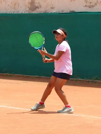 A young player preparing to hit a forehand. Good preparation is the key to a successful shot.