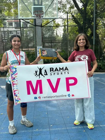 Our player holding the MVP banner at the Rama Sports tournament. Her performance was a key factor in her team's championship run.