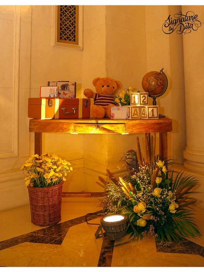 Another elegant detail from the Teddy in London party. A vintage globe, stacked suitcases, and a teddy bear create a sense of travel and adventure.