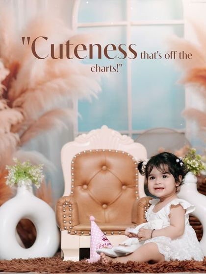 Cuteness that's off the charts. This little girl's first birthday portrait in our pampas grass studio setup is simply adorable.