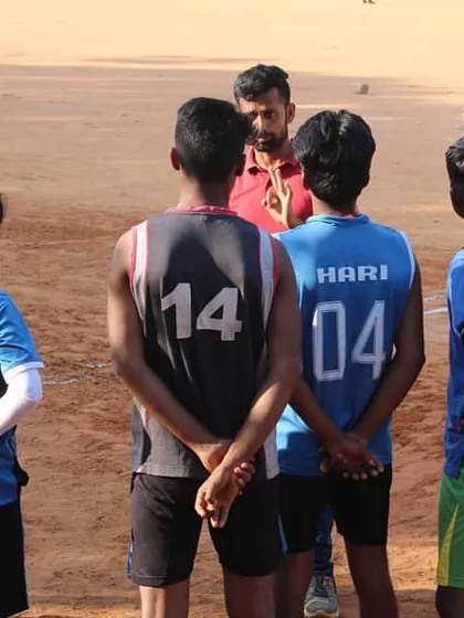 A quick strategy session with the coach during practice. We believe in smart play and constant communication, making sure every player understands their role in the team.