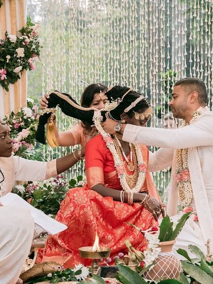 Draping for bride Syama was a beautiful experience. Her traditional red silk saree for her Sanatani wedding ceremony was draped to honour the rituals while ensuring she felt comfortable and radiant.