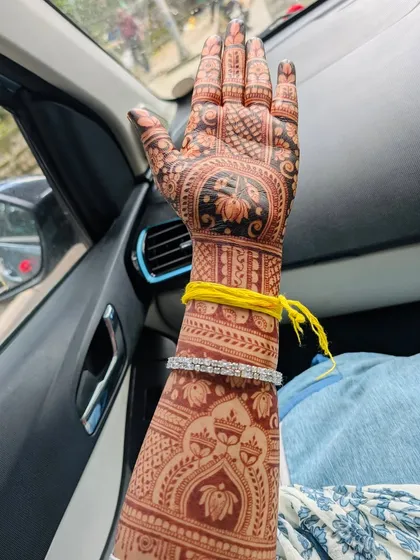 The proof is in the color. This is the gorgeous, dark reddish-brown stain that develops from my 100% organic henna paste. I never use chemicals, so you get a beautiful, long-lasting color that is completely safe for your skin.