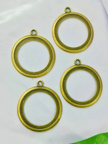 For a more antique look, we offer our large round bezels in a brass finish. These are great for vintage-inspired necklaces or large keychains.