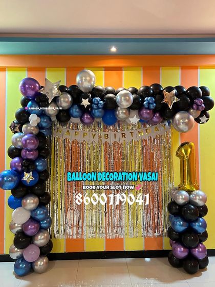 A BTS theme decoration for a K-pop fan. The balloon arch in purple, black, and silver chrome is set against a shimmer curtain for a cool, concert-like vibe.