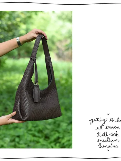 A side view of the All Woven Twill Oak Medium Sunaina. The hand-woven texture covers the entire bag, giving this boho-chic design a rich, artisanal feel.