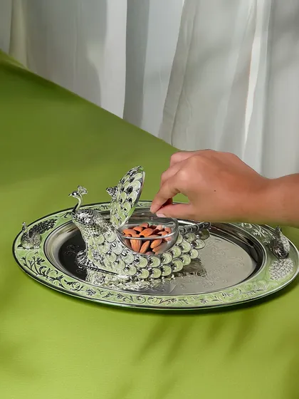A closer look at the functionality of our peacock dry fruit box. The lidded container keeps treats fresh, while the elegant design ensures your hospitality is always served with a touch of grandeur.