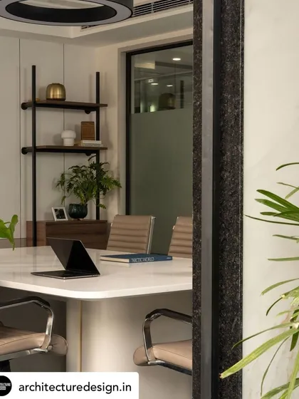 A glimpse into the conference room, showing the clean lines of the table and the thoughtful placement of plants and decor to create a pleasant meeting environment.