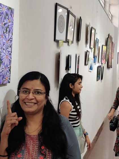 Happily pointing to my work at the Rangoli Metro art gallery during the Cubbon Paints anniversary exhibition.