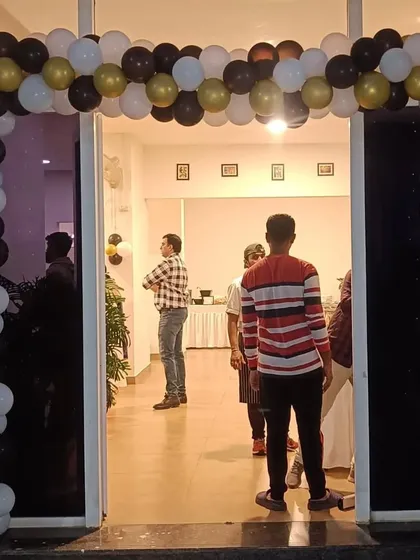 The entrance to the football party, featuring a simple but effective balloon arch in black, white, and gold. It gets everyone excited for the main event inside.