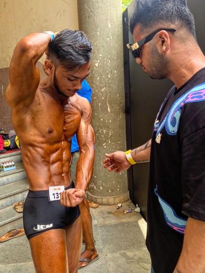 Backstage at the ICN championship, giving my client final instructions. My support is 24/7, right up until the moment they step on stage.