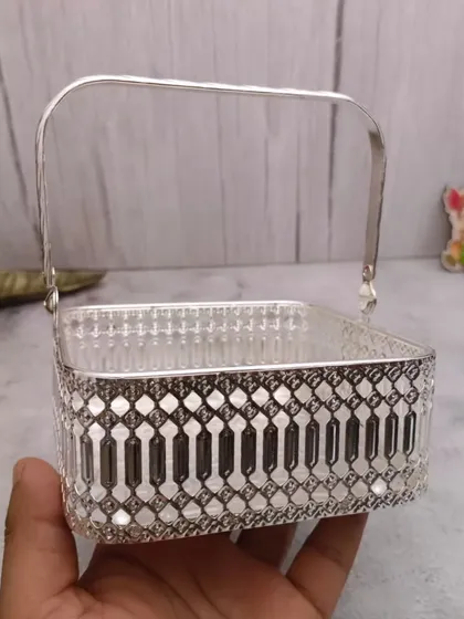 A square German silver basket with a handle, a unique shape that is both practical and decorative.
