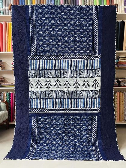 The front of the indigo saree quilt, where we've preserved the original patterns and borders of the fabric.