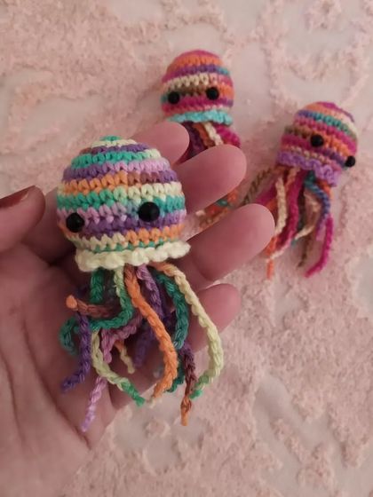 Another look at the colorful jellyfish charms. These are great for bulk orders and can be customized to match any theme.