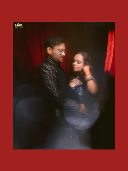 An intimate, artistic portrait of Komal and Pallav, using a soft focus and warm tones to highlight their connection.