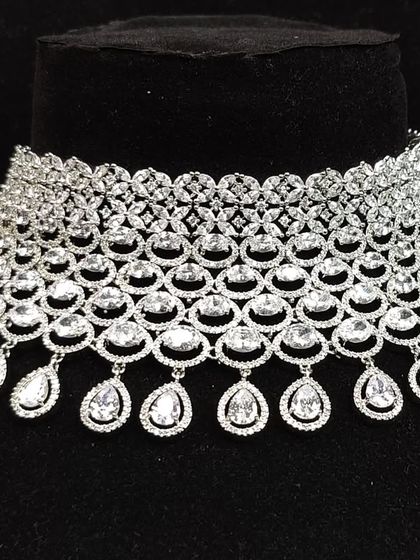 A close-up view of the intricate web-like design of this American diamond choker, a testament to the quality of our rental collection.