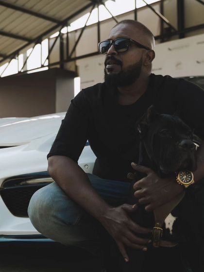 A close up during the Porsche collaboration. My dog is calm and collected, even in a new and exciting environment. This is the result of consistent training and leadership.