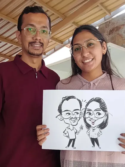 This couple's caricature captures their fun-loving spirit. I enjoy creating full-body drawings that tell a little story about the subjects.