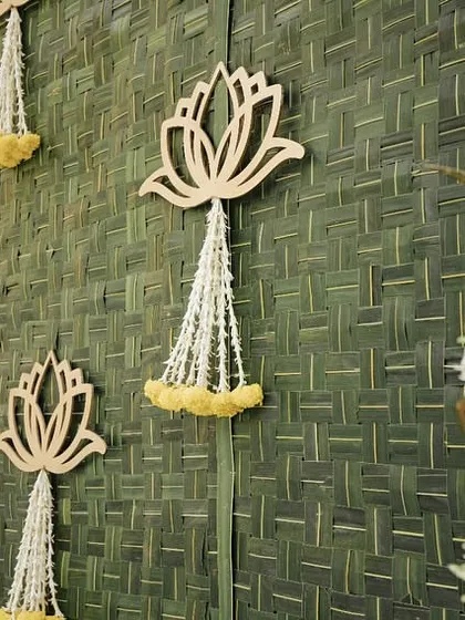 Another detail shot of the backdrop, highlighting the traditional brass 'kalash' and floral details.