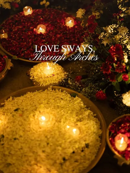 An artfully composed shot of floating candles in bowls of flower petals, with the title "Love Sways Through Arches," capturing the romantic mood.