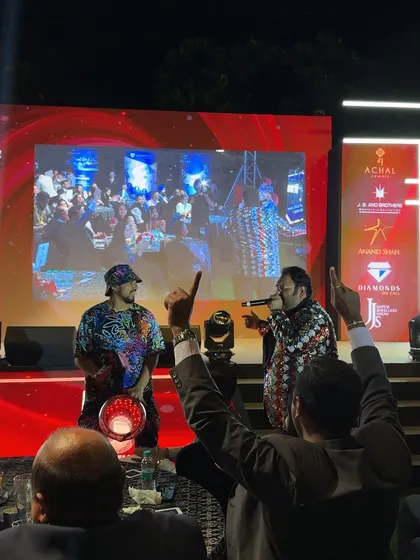 Performing with the MC at the Couture India show, with a live feed of the performance on the screen behind us. This adds a great visual element for large audiences.