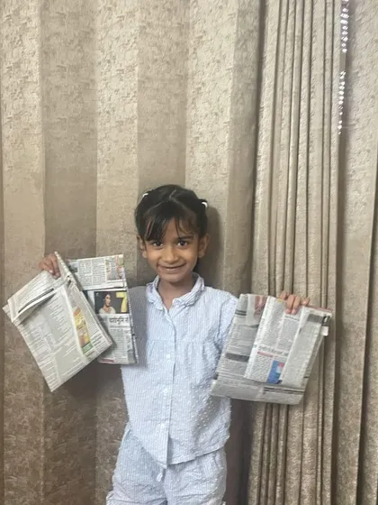 Another one of our proud 'Reuse Rangers', Kashvi, showcasing the newspaper bags she made. These kids are the real Planet Protectors, taking practical steps to create a zero-waste future.