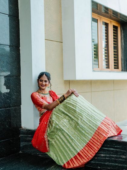 My beautiful client Chethana looks stunning in this custom Kanchi Pattu tissue lehenga. The sea-green and red combination is a classic, and I designed it as a Langa Voni for a traditional yet fresh look for her special day.