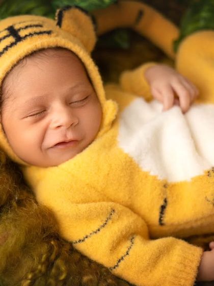 Roar. This little tiger cub was an absolute joy to photograph. I have a collection of adorable animal outfits that make for fun and playful themed sessions.