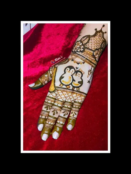 A cute penguin couple on the back of the hand for an engagement. This is a sweet and modern way to symbolize your partnership.