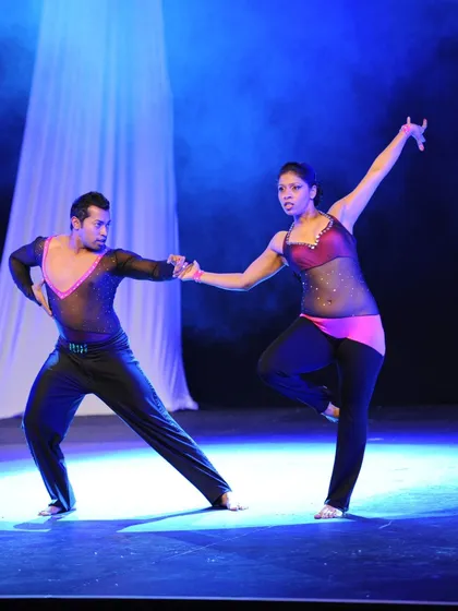 An early performance shot under the stage lights. You can see the focus and connection between us, even in the early days of our 15-year dance journey.