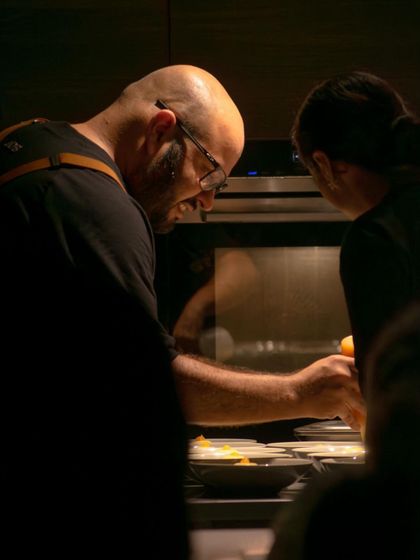 Me in the kitchen during a pop-up event, focused on getting the details right.