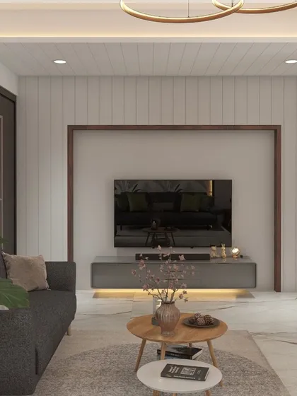 This is a great example of a compact living area that feels spacious and stylish. The light color palette, vertical wall paneling, and minimalist furniture create a clean, modern aesthetic.
