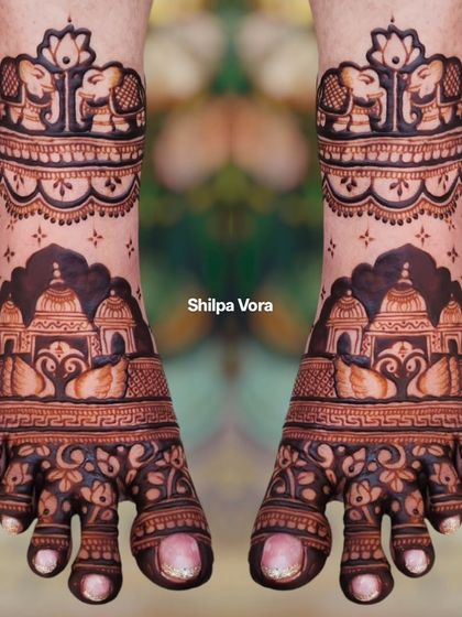 The same temple and swan design shown in natural light, giving a sense of how the mehndi will look during outdoor wedding ceremonies.