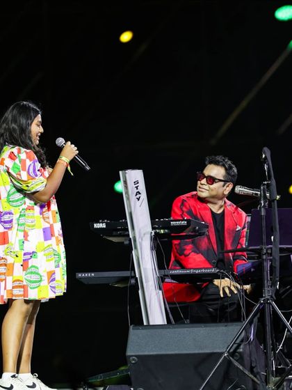 A beautiful moment where A.R. Rahman shares the stage with a young fan, creating a once-in-a-lifetime memory.