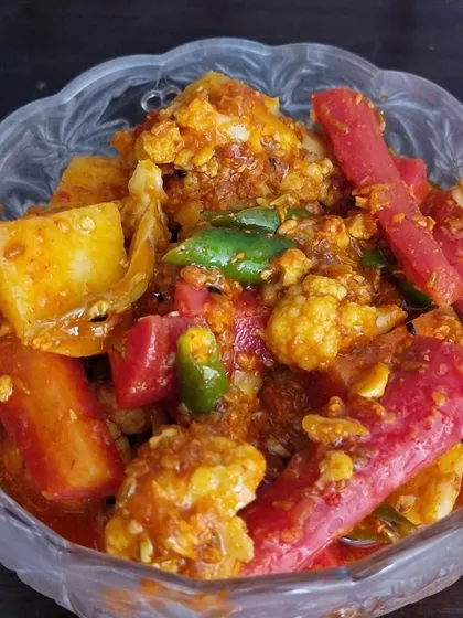 The famous winter special, Gajar Gobhi Shalgam achaar. It has a lovely khatta-meetha taste from the fresh carrots, cauliflower, and turnips mixed with jaggery and spices. It's a seasonal favorite that sells out fast.