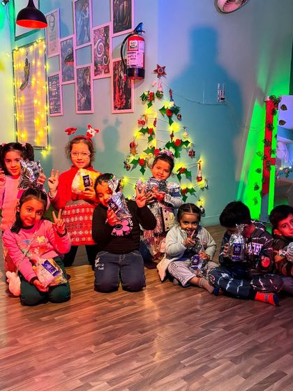 Peace signs and happy smiles. Our studio is a place where kids feel comfortable and can be themselves.