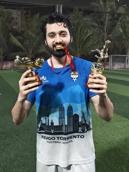 One of our players, a winner on and off the screen, celebrating with his individual awards after a tournament.