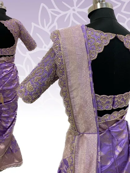 A full view of the lavender bridal saree and blouse, showing the dramatic open back with its scalloped, embroidered edges.