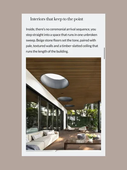 The feature highlighted the interior details, such as the continuous timber-slatted ceiling and beige stone floors that create an unbroken, sweeping feel throughout the space.