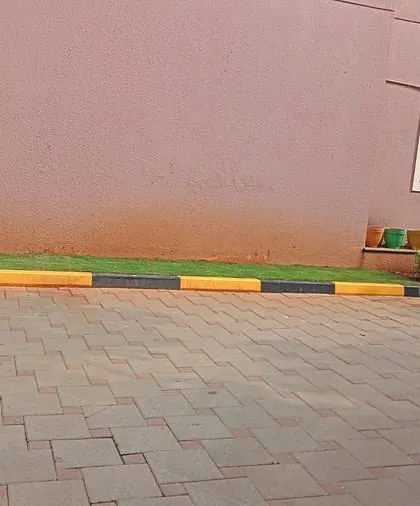 Another angle of the landscaping work at Sobha Carnation, showing the clean lines of the new lawn and curb.