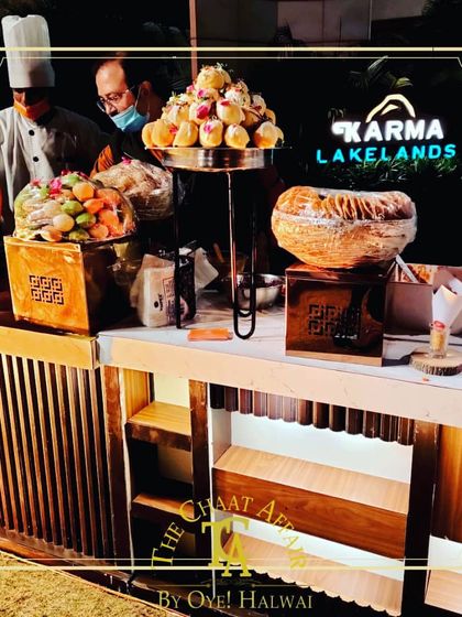 Our chaat station at Karma Lakelands, showcasing a tiered display of Dahi Puris and other colorful chaat items. We make every special occasion a bit more special with our luxury catering.