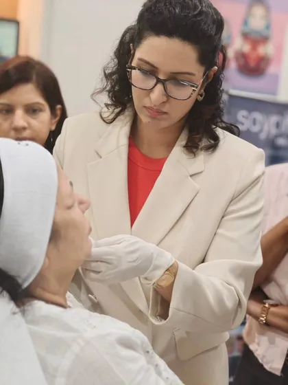 Precision is key when working with dermal fillers. This is a moment from a hands-on workshop I conducted for young dermatologists, demonstrating the careful technique required to achieve subtle, beautiful facial contouring.