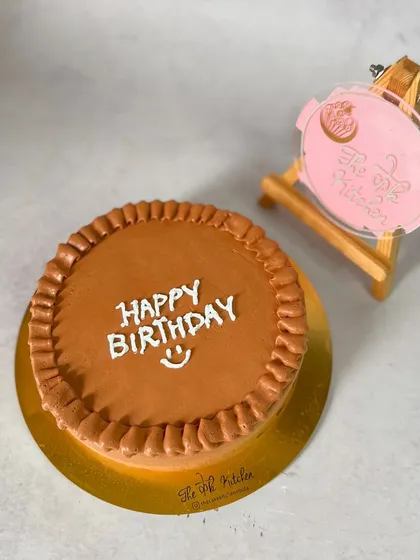Sometimes simple is best. This is a classic chocolate truffle bento cake with a simple piped border and a "Happy Birthday" message, perfect for a minimalist celebration.