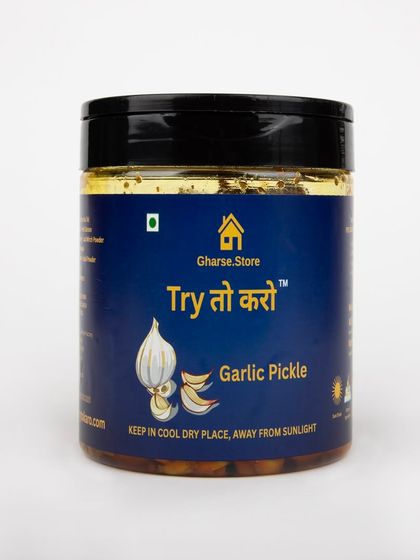 A medium jar of Garlic Pickle, isolated on white.