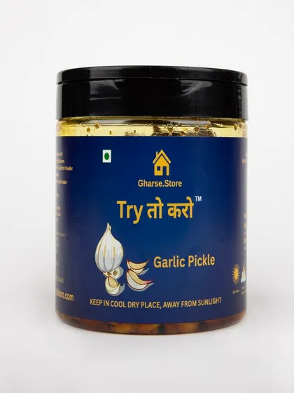 A medium jar of Garlic Pickle, isolated on white.