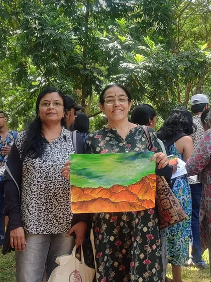 Two artists proudly showing their work. It is a wonderful feeling to create something beautiful with your own hands.