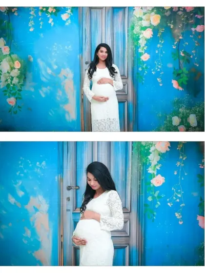 Two beautiful solo portraits against our modern blue door backdrop. These shots highlight the elegance of the white lace dress and the serene expression of the mom-to-be.