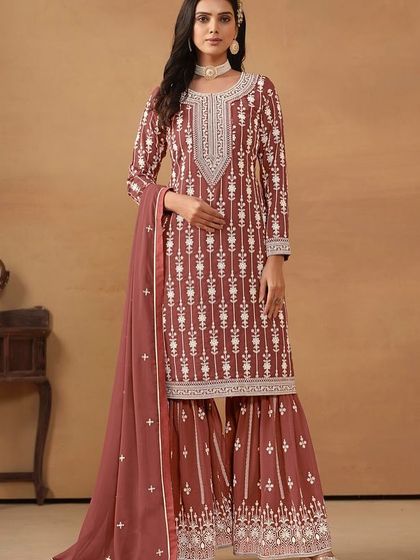 This chocolate-colored salwar kameez is rich and elegant. The all-over thread embroidery on the georgette fabric gives it a classic, timeless appeal.