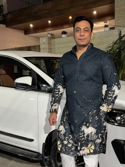 Here’s a customer looking sharp in one of our designer kurtas. This black kurta features a unique print, making it perfect for festive occasions or a special evening out. It shows how I blend comfort with standout style.