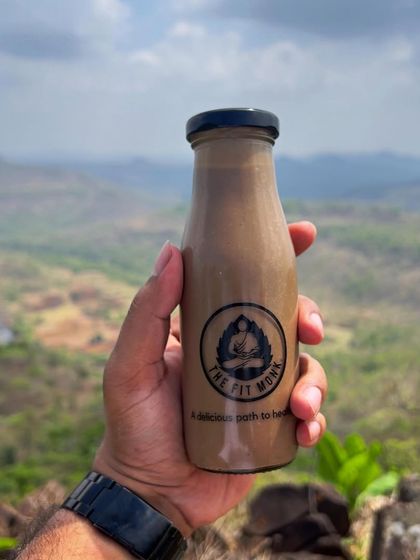 Fuel your adventures with my refreshing smoothies. This one is enjoyed with a scenic mountain view, proving that healthy choices can be part of an adventurous lifestyle.